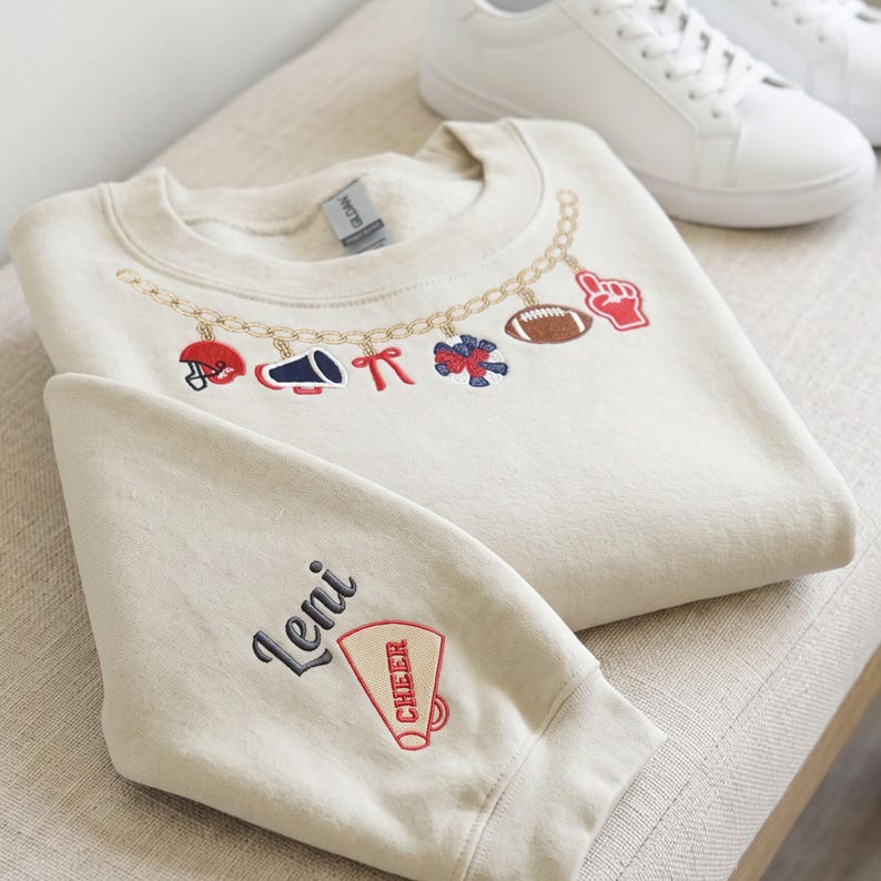 Custom Sports Charm Necklace Sweatshirt, Personalized Sleeve Name Cheer Football Crewneck, Coquette Bow Game Day Pullover